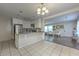 Bright kitchen with white cabinets, granite countertops, tile floor and an open layout at 3540 Victoria St, Atlanta, GA 30337