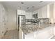 Well-equipped kitchen featuring sleek white cabinets, granite countertops, and stainless steel appliances at 3540 Victoria St, Atlanta, GA 30337