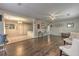Open-concept living space featuring hardwood floors and seamless transitions to the adjacent kitchen at 3540 Victoria St, Atlanta, GA 30337