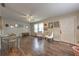 Inviting living room featuring hardwood floors, a ceiling fan, and a front door entrance at 3540 Victoria St, Atlanta, GA 30337