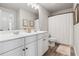 Bright bathroom with double sinks, vanity, and shower with curtain, providing a fresh feel at 406 Dunaway Ct, Grayson, GA 30017