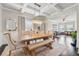 Formal dining room with coffered ceilings, modern chandelier, and elegant seating for memorable gatherings at 406 Dunaway Ct, Grayson, GA 30017