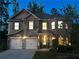 Charming two-story home featuring a stone facade, manicured lawn, and inviting front entrance at 406 Dunaway Ct, Grayson, GA 30017