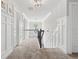 Hallway with carpet, white trim and doors leading to bedrooms at 406 Dunaway Ct, Grayson, GA 30017