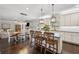 Spacious kitchen with white cabinetry, granite countertops, and dark hardwood floors at 406 Dunaway Ct, Grayson, GA 30017