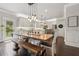 Eat-in kitchen with stainless appliances, island seating and adjacent dining with access to the outdoors at 406 Dunaway Ct, Grayson, GA 30017