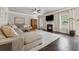 Spacious living room features a fireplace, plush sofa, hardwood floors, and abundant natural light at 406 Dunaway Ct, Grayson, GA 30017