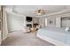 Spacious main bedroom suite with sitting area, trey ceilings, plush carpet, and natural light at 406 Dunaway Ct, Grayson, GA 30017