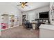Well-lit home office with custom shelving, desk space, and a comfortable workspace at 406 Dunaway Ct, Grayson, GA 30017
