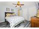 Bedroom featuring gray walls, wood floors, ceiling fan and modern decor at 859 Pownal Ln, Hampton, GA 30228
