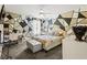 Stylish bedroom with geometric wall art, study desk and chair, plus a tufted storage bench at 859 Pownal Ln, Hampton, GA 30228