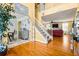 Inviting two-story entryway featuring hardwood floors and an open staircase at 859 Pownal Ln, Hampton, GA 30228