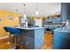 Bright kitchen with stainless steel appliances, a breakfast bar, and hardwood floors at 859 Pownal Ln, Hampton, GA 30228