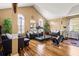 Cozy living room area with hardwood floors and abundant natural light, great for relaxing or entertaining at 859 Pownal Ln, Hampton, GA 30228