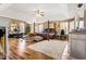 Large primary bedroom with hardwood floors, seating, and an ensuite bathroom at 859 Pownal Ln, Hampton, GA 30228