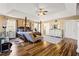 Large primary bedroom with hardwood floors, seating, and ensuite bathrooms at 859 Pownal Ln, Hampton, GA 30228