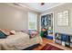 Bedroom featuring hardwood floors, natural light, and closet space at 2434 Skyland Ne Trl, Brookhaven, GA 30319
