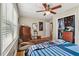 Bedroom featuring hardwood floors, a ceiling fan, and closet space at 2434 Skyland Ne Trl, Brookhaven, GA 30319