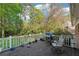 Wooden deck with a grill overlooking a verdant yard, perfect for outdoor cooking and gatherings at 2434 Skyland Ne Trl, Brookhaven, GA 30319