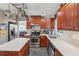 Bright kitchen boasts stainless appliances, an island, and dark wood cabinets at 2434 Skyland Ne Trl, Brookhaven, GA 30319