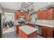 Well-equipped kitchen with a center island, stainless appliances, and hanging pot rack offering both style and functionality at 2434 Skyland Ne Trl, Brookhaven, GA 30319
