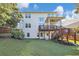 Back exterior with a spacious backyard and a deck with stairs for outdoor enjoyment at 5386 Bluestone Cir, Mableton, GA 30126