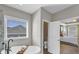 This bathroom has a soaking tub and a door that leads into the main bedroom at 5386 Bluestone Cir, Mableton, GA 30126