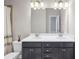 Bathroom featuring double sinks, modern vanity, and a large mirror at 5386 Bluestone Cir, Mableton, GA 30126