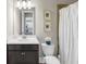 Well-lit bathroom featuring dark vanity and shower with curtain at 5386 Bluestone Cir, Mableton, GA 30126