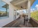 Covered deck offers a cozy outdoor space with views of the surrounding neighborhood at 5386 Bluestone Cir, Mableton, GA 30126