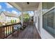 Covered wooden deck featuring wooden benches and railings, providing a comfortable outdoor space at 5386 Bluestone Cir, Mableton, GA 30126