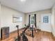Exercise room with wood floors, spin bikes, art, and access to the outdoors at 5386 Bluestone Cir, Mableton, GA 30126