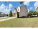 Two-story home with siding and brick features an attached garage and long driveway with manicured lawn at 5386 Bluestone Cir, Mableton, GA 30126
