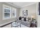 Comfortable living room with plush seating, shuttered windows, and stylish decor at 5386 Bluestone Cir, Mableton, GA 30126
