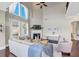Bright living room with soaring ceilings, a fireplace, and a wall of windows at 5386 Bluestone Cir, Mableton, GA 30126
