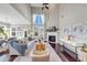 Elegant living room with a fireplace, hardwood floors, and ample natural light at 5386 Bluestone Cir, Mableton, GA 30126