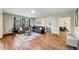 Spacious living room with hardwood floors, modern decor, and a comfortable leather sectional at 5386 Bluestone Cir, Mableton, GA 30126