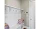 Functional mudroom featuring built-in storage, hooks, and bench at 5386 Bluestone Cir, Mableton, GA 30126