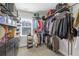 Organized walk-in closet with shelves, racks, and storage boxes for shoes and clothing at 5386 Bluestone Cir, Mableton, GA 30126