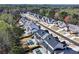 Aerial of community showcasing luxurious homes, tree-lined streets, and neighborhood layout at 109 Owens Mill Pl, Canton, GA 30115