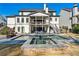 Back of the house features a two-story porch and backyard with a spa and a pool at 109 Owens Mill Pl, Canton, GA 30115