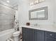 Elegant bathroom with blue-grey cabinets, neutral wall color, and updated vanity with framed mirror at 109 Owens Mill Pl, Canton, GA 30115