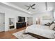 Spacious primary bedroom boasting hard wood floors, neutral walls and ceiling fan at 109 Owens Mill Pl, Canton, GA 30115