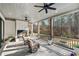 Inviting covered patio with fireplace and outdoor seating overlooking pool and wooded backyard at 109 Owens Mill Pl, Canton, GA 30115