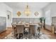 Elegant dining room with stylish furnishings, a modern chandelier, and sophisticated decor, perfect for Gathering gatherings at 109 Owens Mill Pl, Canton, GA 30115