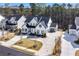 Beautifully landscaped home with a long driveway and a three-car garage at 109 Owens Mill Pl, Canton, GA 30115