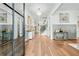 Grand foyer with gleaming hardwood floors, a modern chandelier, and elegant decor at 109 Owens Mill Pl, Canton, GA 30115