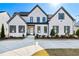 Charming home with manicured lawn, elegant brick facade, and inviting front entrance at 109 Owens Mill Pl, Canton, GA 30115