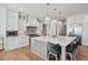 Modern kitchen with an oversized island, quartz countertop, and pendant lighting at 109 Owens Mill Pl, Canton, GA 30115