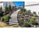 Professionally landscaped backyard with tiered steps leading to upper levels at 109 Owens Mill Pl, Canton, GA 30115